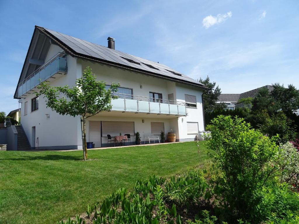 a white house with a large yard at Turm im Blick in Dietingen