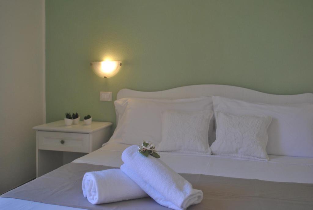 Postel nebo postele na pokoji v ubytování Hotel Stella D'Oro