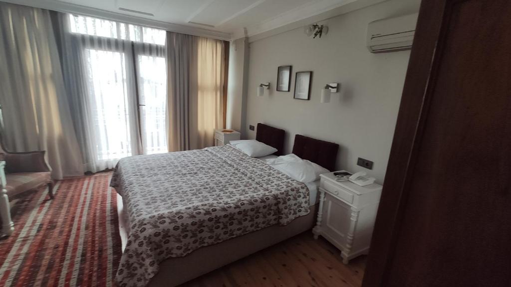 Postel nebo postele na pokoji v ubytování Turkoman Hotel