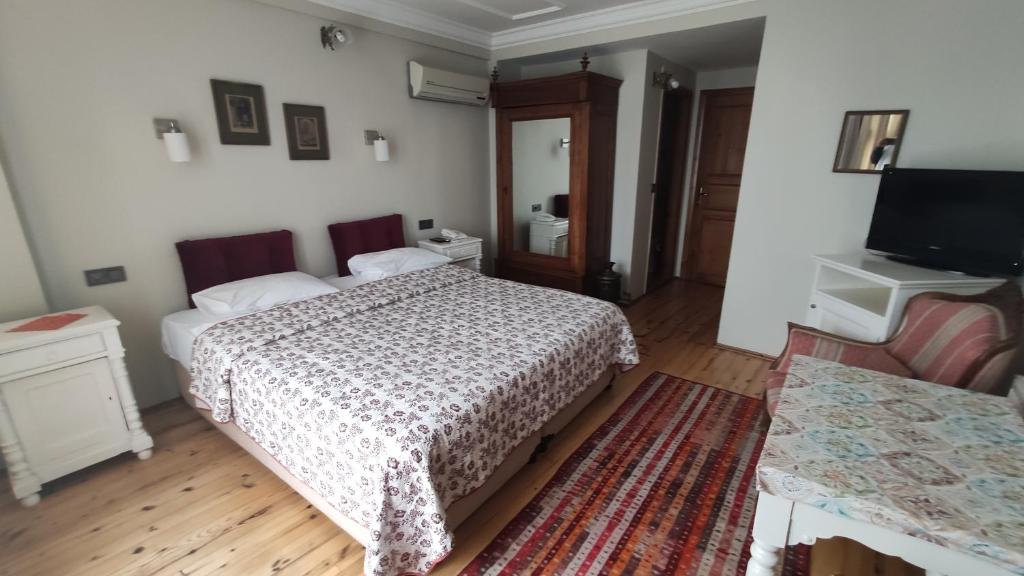 Postel nebo postele na pokoji v ubytování Turkoman Hotel
