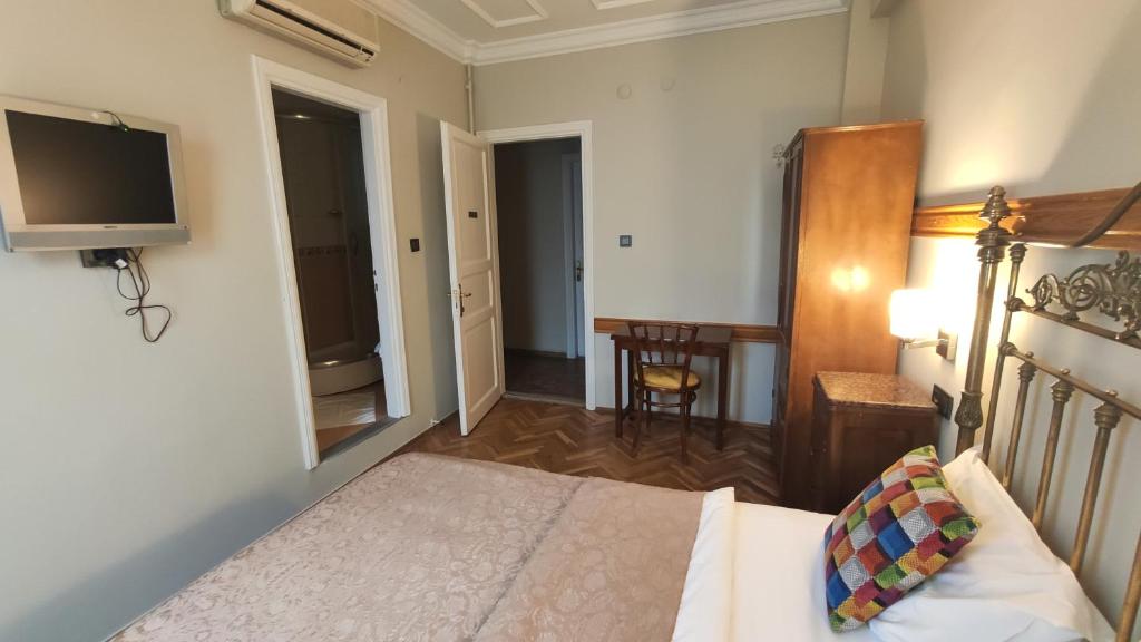 Postel nebo postele na pokoji v ubytování Turkoman Hotel