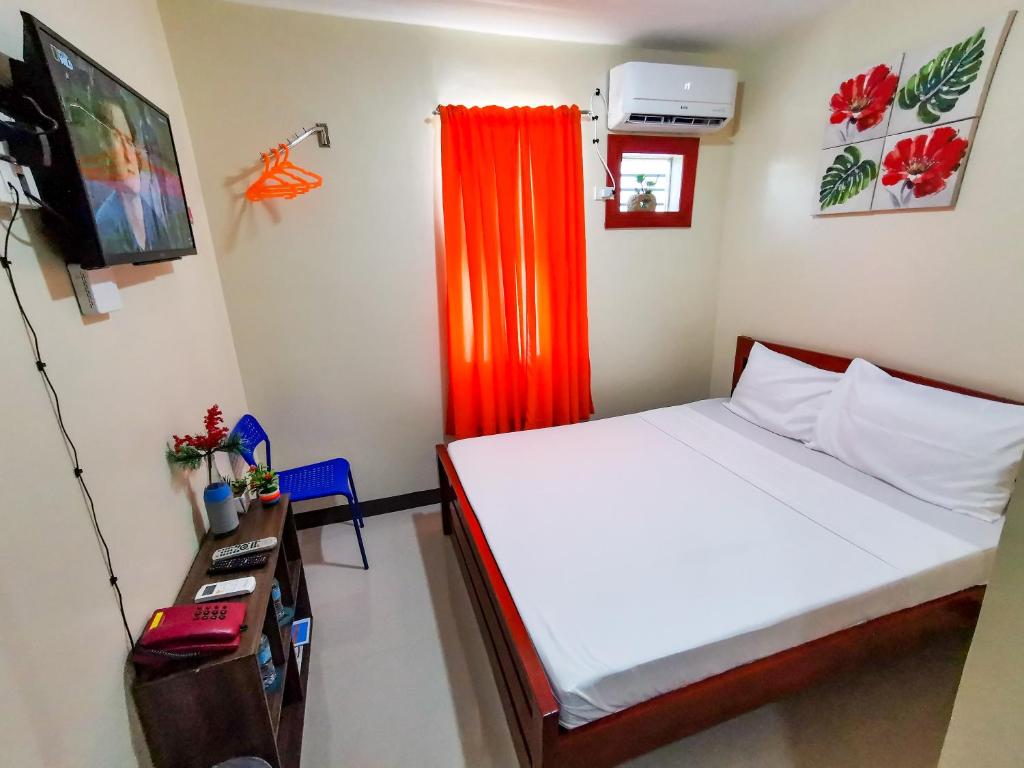 Postel nebo postele na pokoji v ubytování Downtown Suites