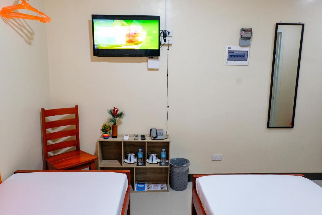 Postel nebo postele na pokoji v ubytování Downtown Suites