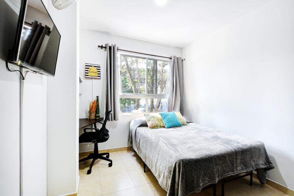 TV a/nebo společenská místnost v ubytování International House Co-Living