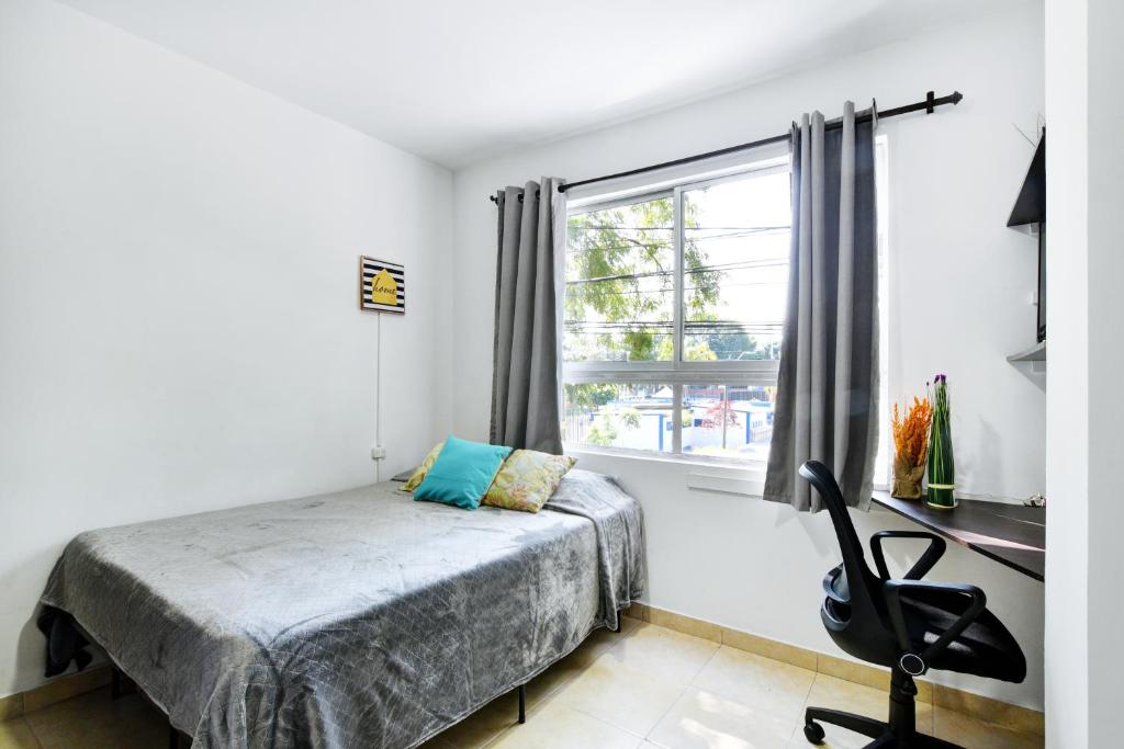 Postel nebo postele na pokoji v ubytování International House Co-Living