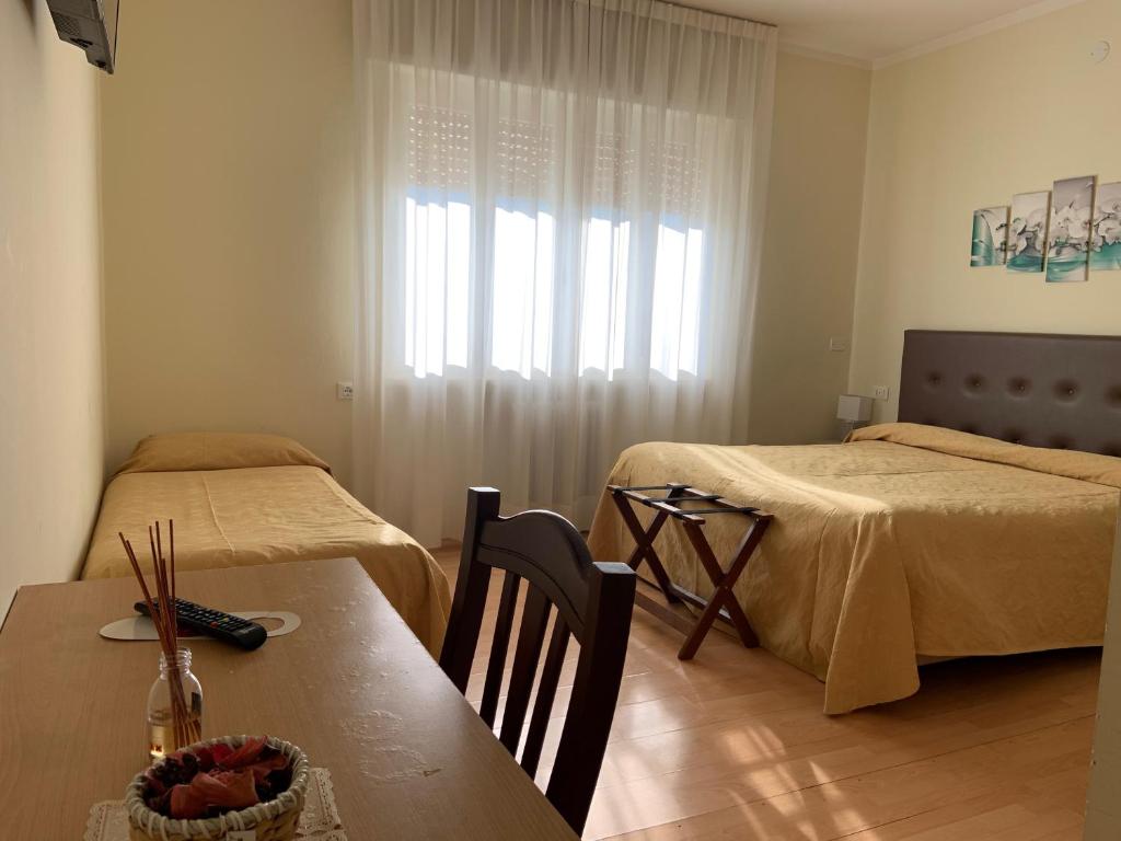Postel nebo postele na pokoji v ubytování La Lanterna