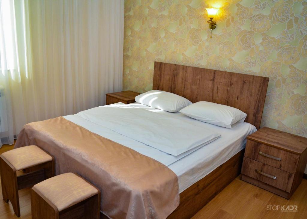 Postel nebo postele na pokoji v ubytování ASOUR HOTEL