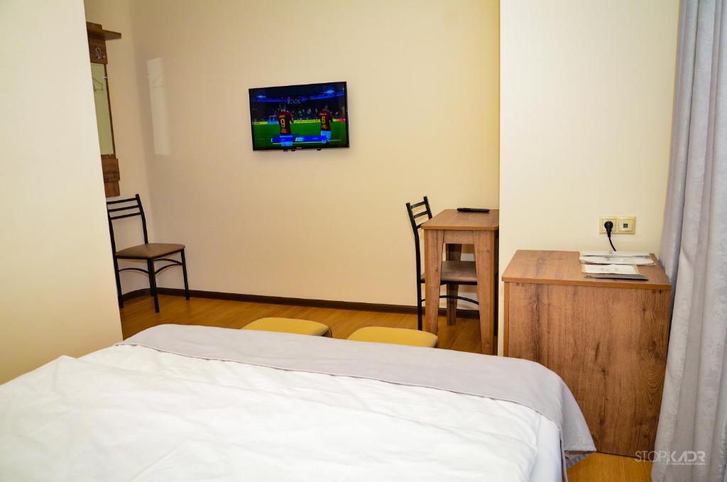 Postel nebo postele na pokoji v ubytování ASOUR HOTEL