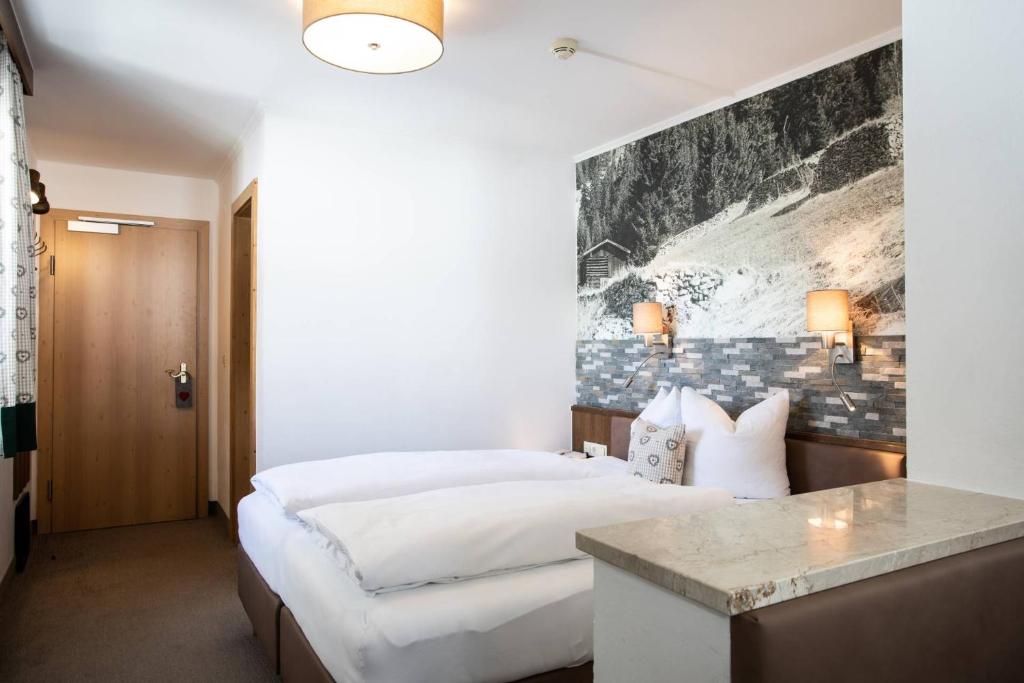 Posteľ alebo postele v izbe v ubytovaní Hotel Bergland Superior