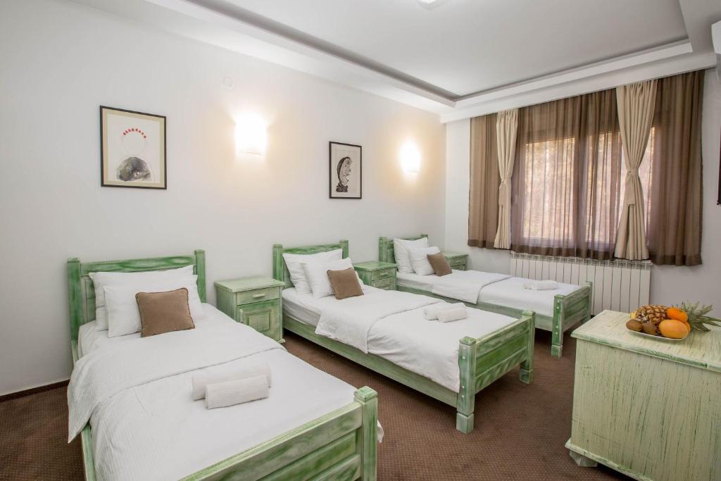 Postel nebo postele na pokoji v ubytování Hotel Trim