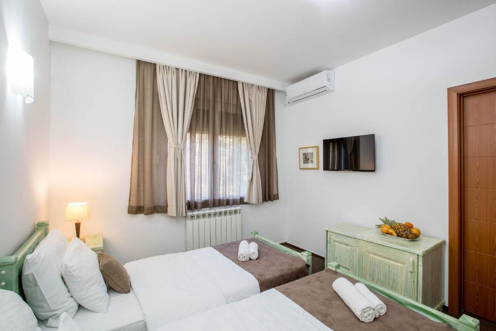 Postel nebo postele na pokoji v ubytování Hotel Trim