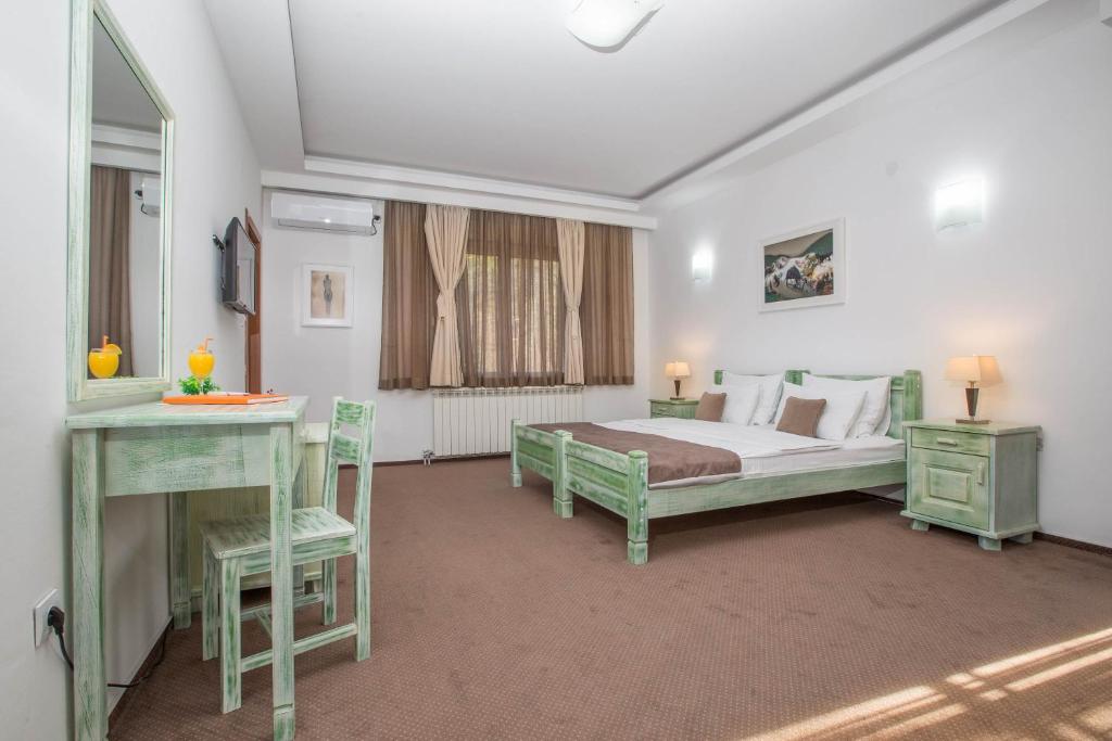 Postel nebo postele na pokoji v ubytování Hotel Trim