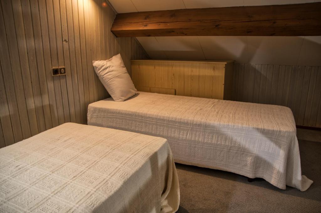 Postel nebo postele na pokoji v ubytování La Bastide d'Albignac