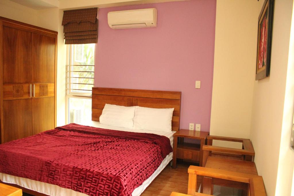 Postel nebo postele na pokoji v ubytování An Phú Motel