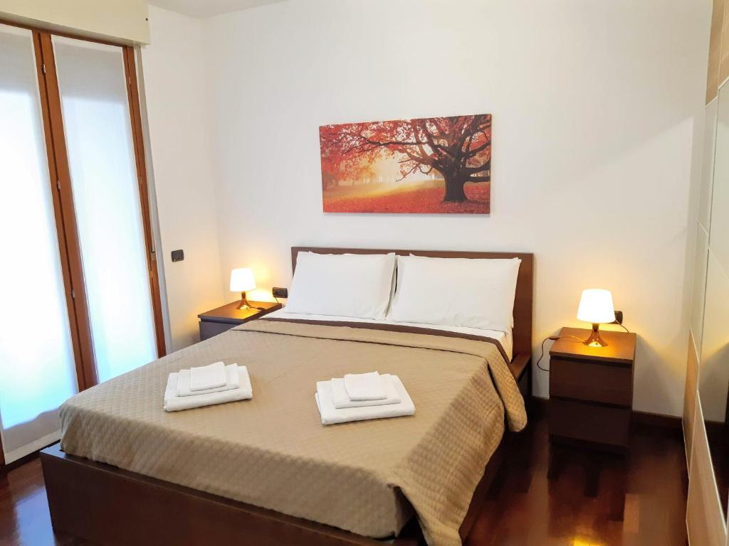 Łóżko lub łóżka w pokoju w obiekcie Suite Rent Milan