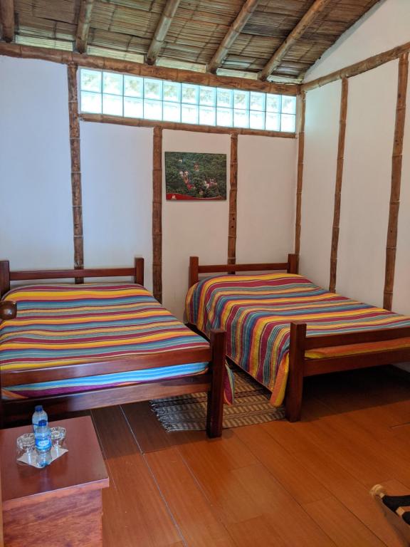 Voodi või voodid majutusasutuse Hacienda Guayabal toas