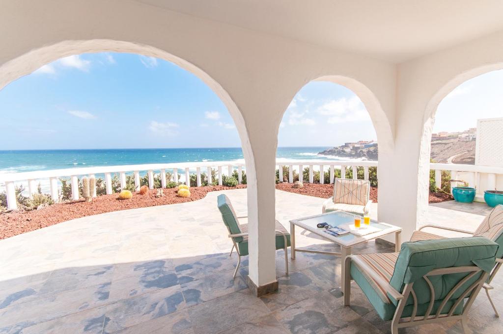 a patio with a view of the ocean at Terrace on the Beach in Telde