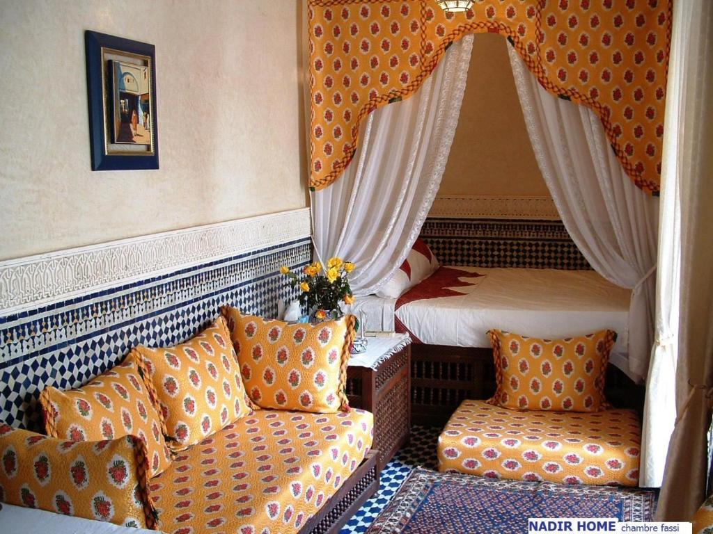 Postel nebo postele na pokoji v ubytování Nadir Home