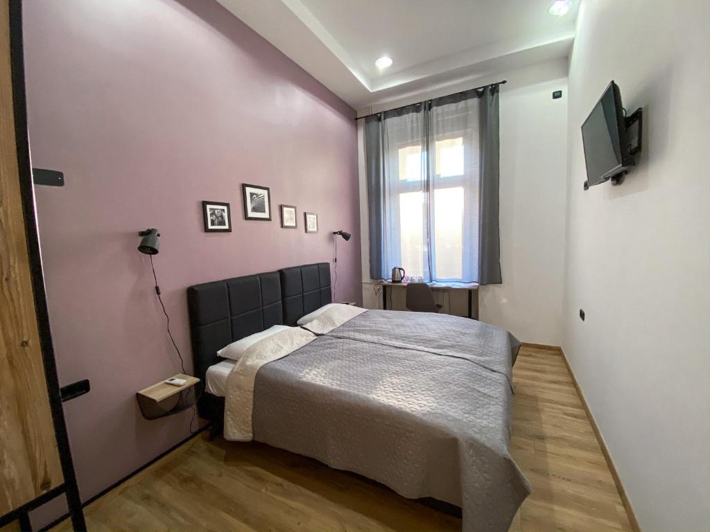 Postel nebo postele na pokoji v ubytování K43 Rooms