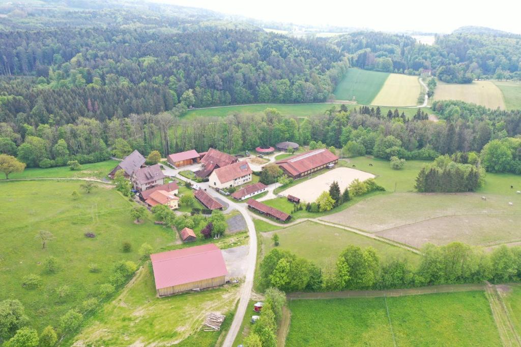 an aerial view of a house in a field at Bio Hofgut Wiggenweiler in Bermatingen