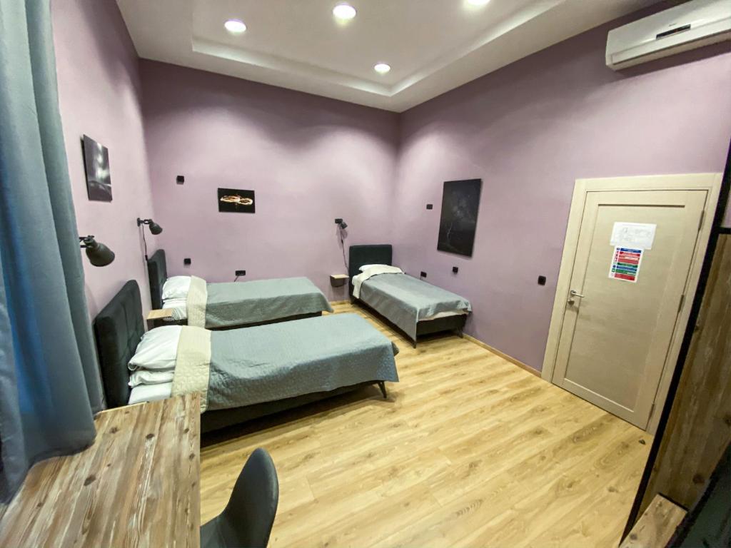 Postel nebo postele na pokoji v ubytování K43 Rooms