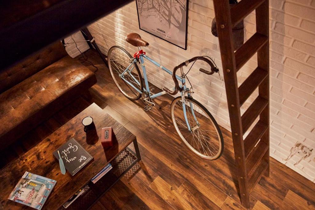 a bike hanging on a wall in a room at “Forte 99” in Venice in Mestre