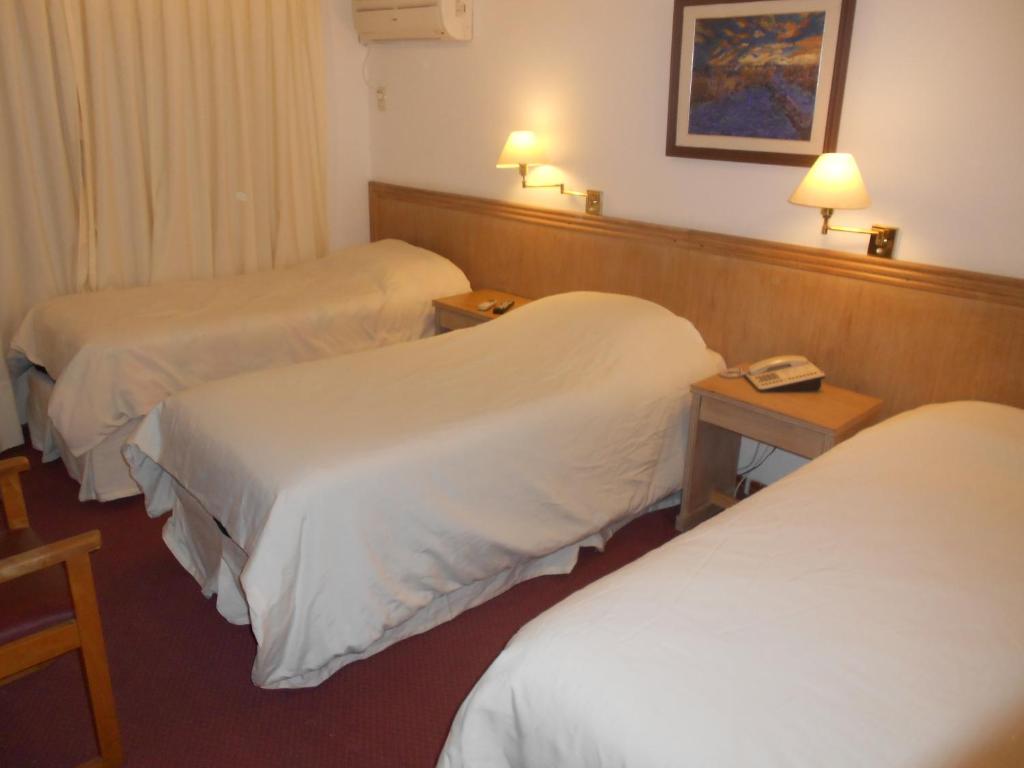 Postel nebo postele na pokoji v ubytování Tanger Hotel