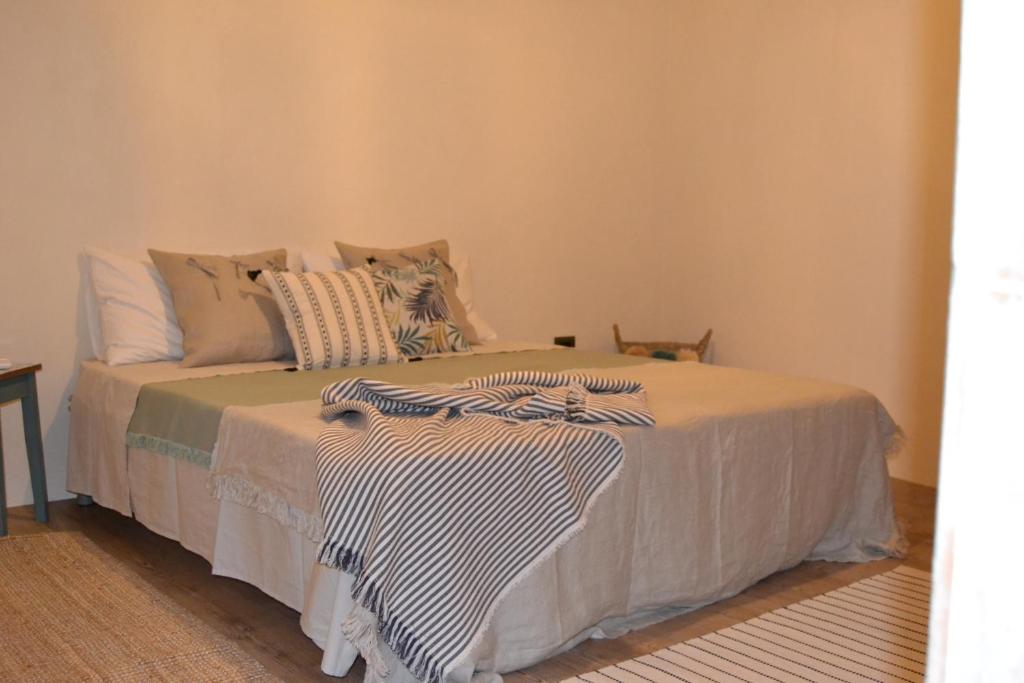 A bed or beds in a room at Ai due Mori Apt by Addler House Ospitality