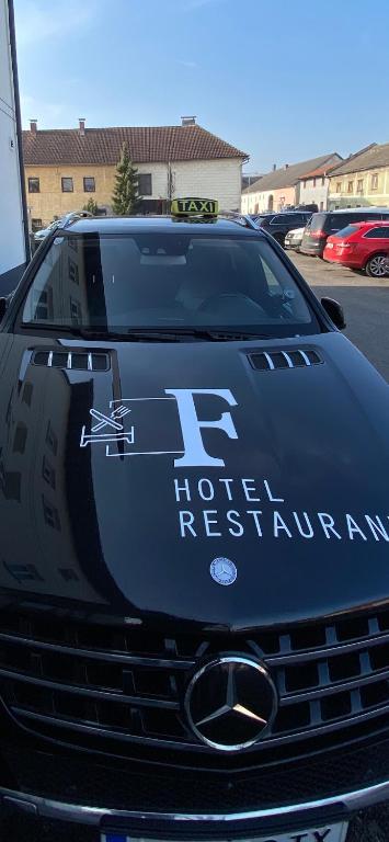 a black car with the words hotel registration on the front at F Hotel in Hörsching