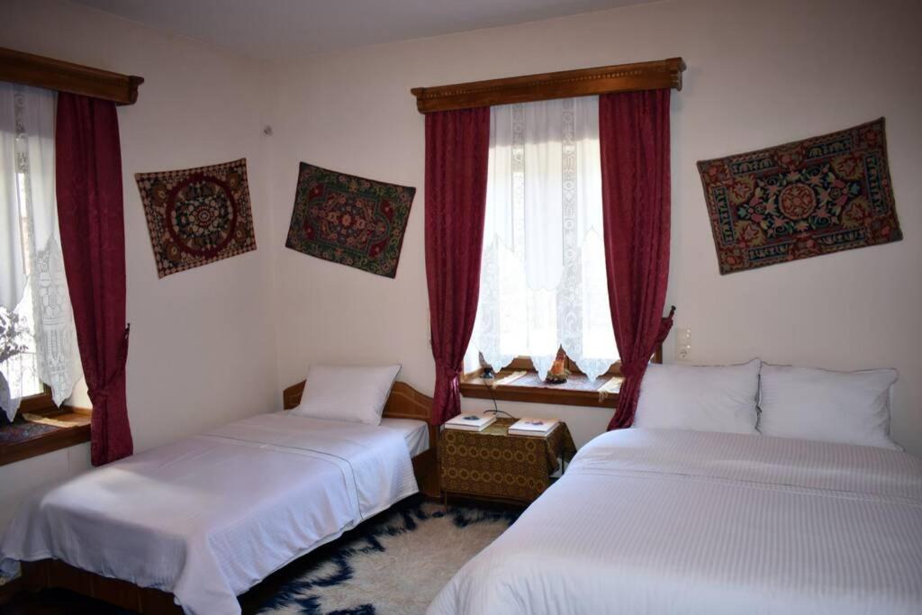 Postel nebo postele na pokoji v ubytování Eufrosini Guesthouse