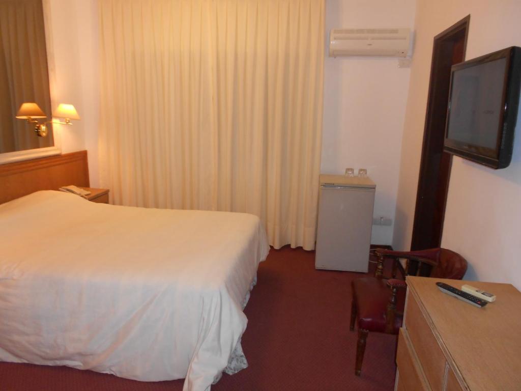Postel nebo postele na pokoji v ubytování Tanger Hotel