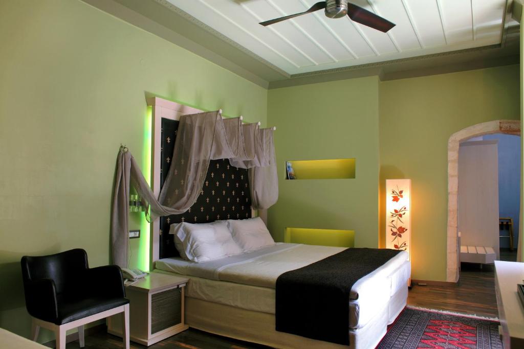 Postel nebo postele na pokoji v ubytování Elia Fatma Boutique Hotel