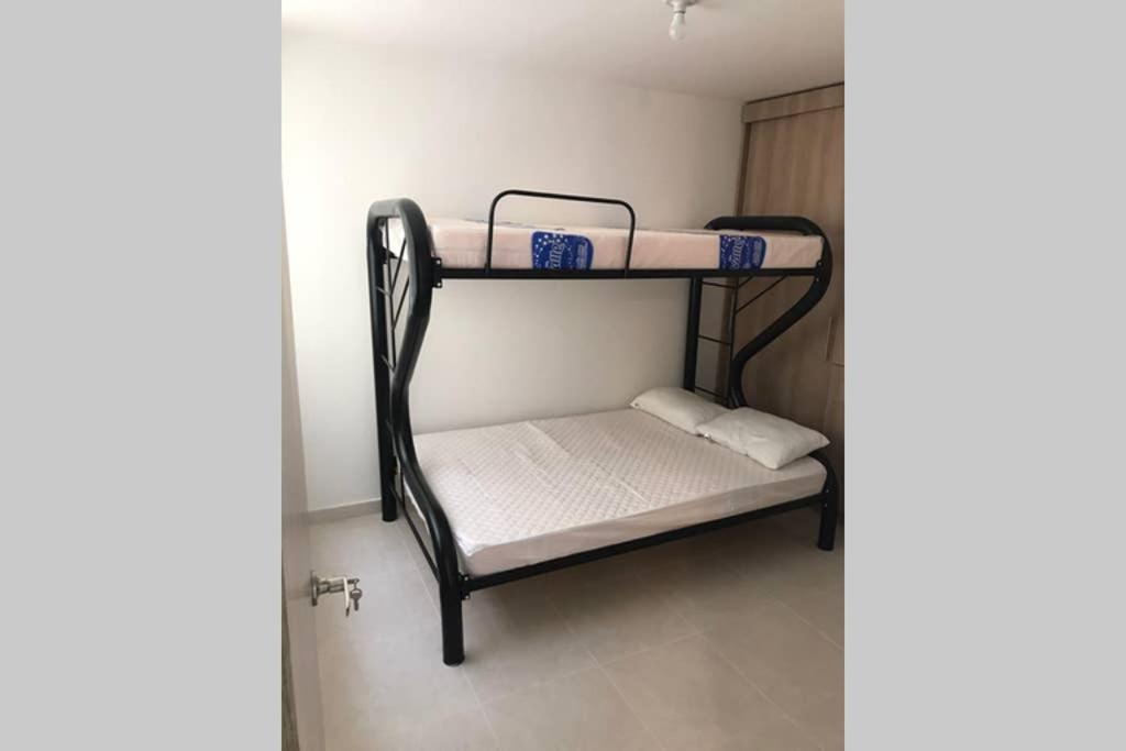Postel nebo postele na pokoji v ubytování Apartamento cómodo con todo lo que necesitas con Aire Acondicionado !!