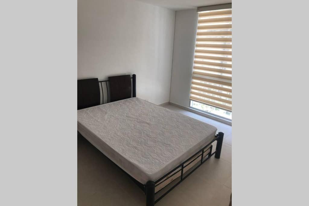 Postel nebo postele na pokoji v ubytování Apartamento cómodo con todo lo que necesitas con Aire Acondicionado !!