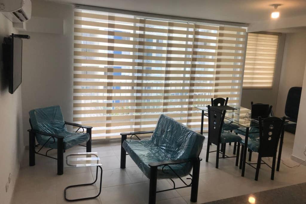 Posezení v ubytování Apartamento cómodo con todo lo que necesitas con Aire Acondicionado !!