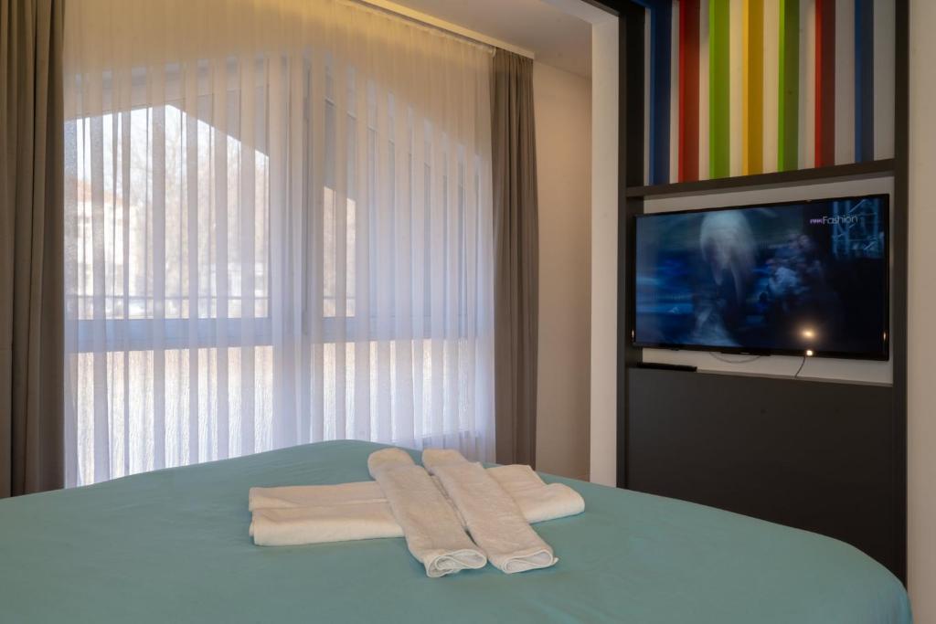 Ένα ή περισσότερα κρεβάτια σε δωμάτιο στο Apartments Slana Oaza