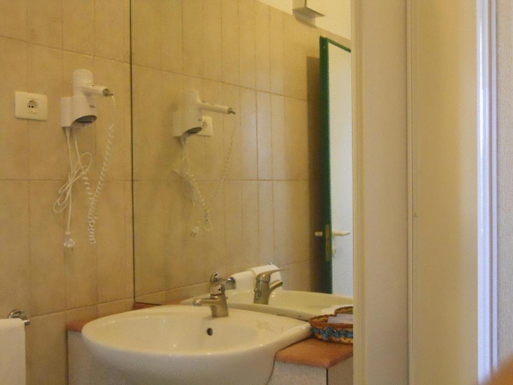 Koupelna v ubytování Hotel Traghetto