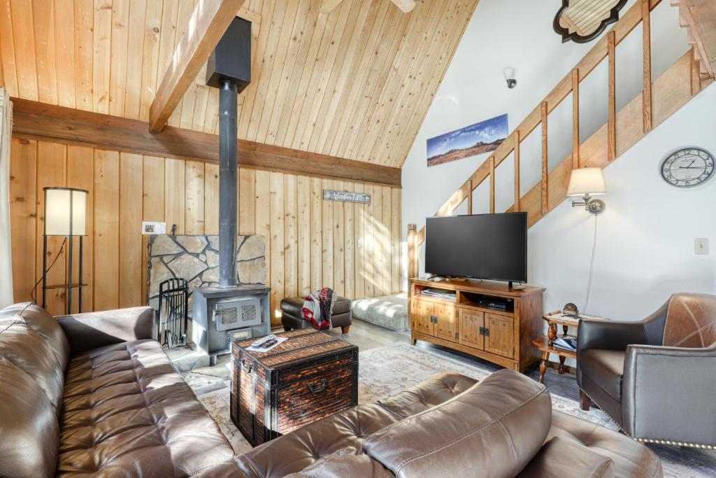 a living room with a couch and a fireplace at 3 Lofty Lane in Sunriver