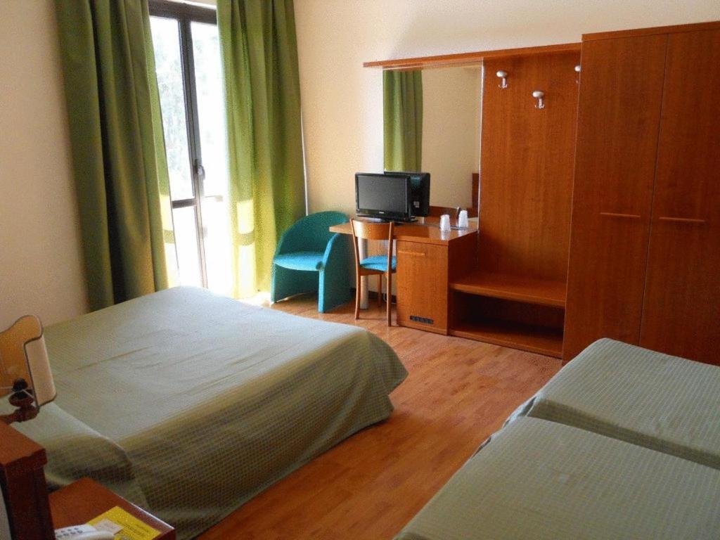 Postel nebo postele na pokoji v ubytování Hotel Traghetto