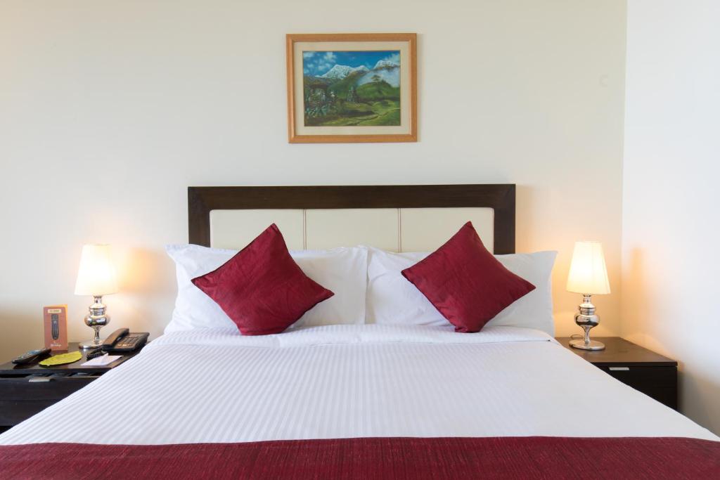 Postel nebo postele na pokoji v ubytování Hotel Himalaya