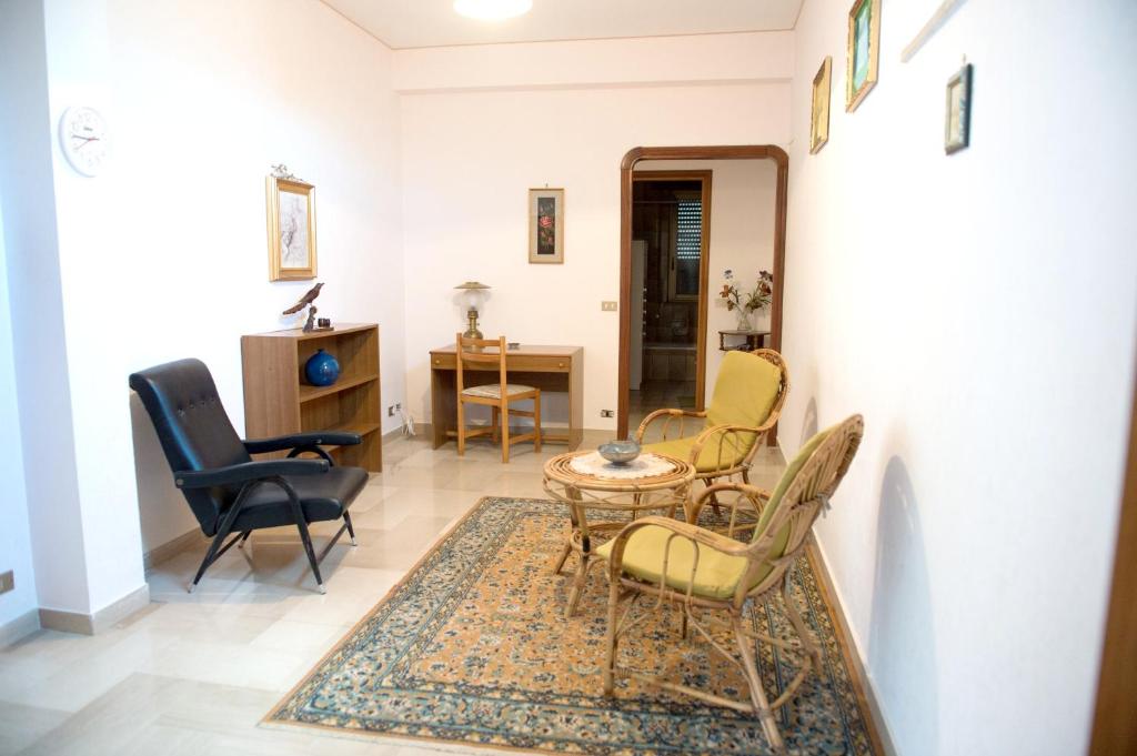 a living room with chairs and a table at 2 bedrooms appartement with terrace at Vita in Vita