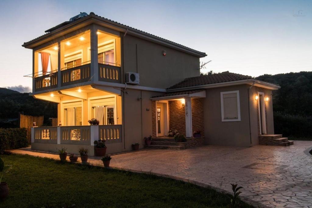a house with a lot of lights on it at VILLA FAIRIES in Lygia