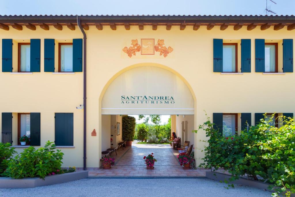 an entrance to a building with a sign that reads santander architecture at Sant'Andrea Agriturismo con cantina Martignago Vignaioli Asolo Prosecco Docg Wines in Maser