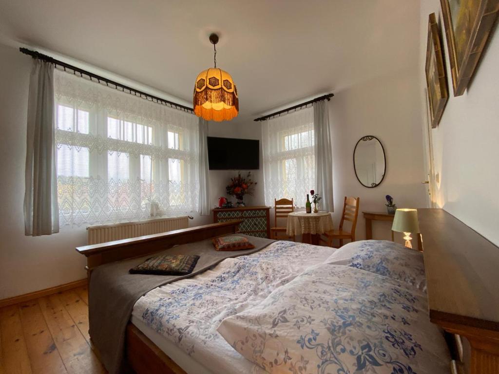 Posteľ alebo postele v izbe v ubytovaní Villa Parkowa 5