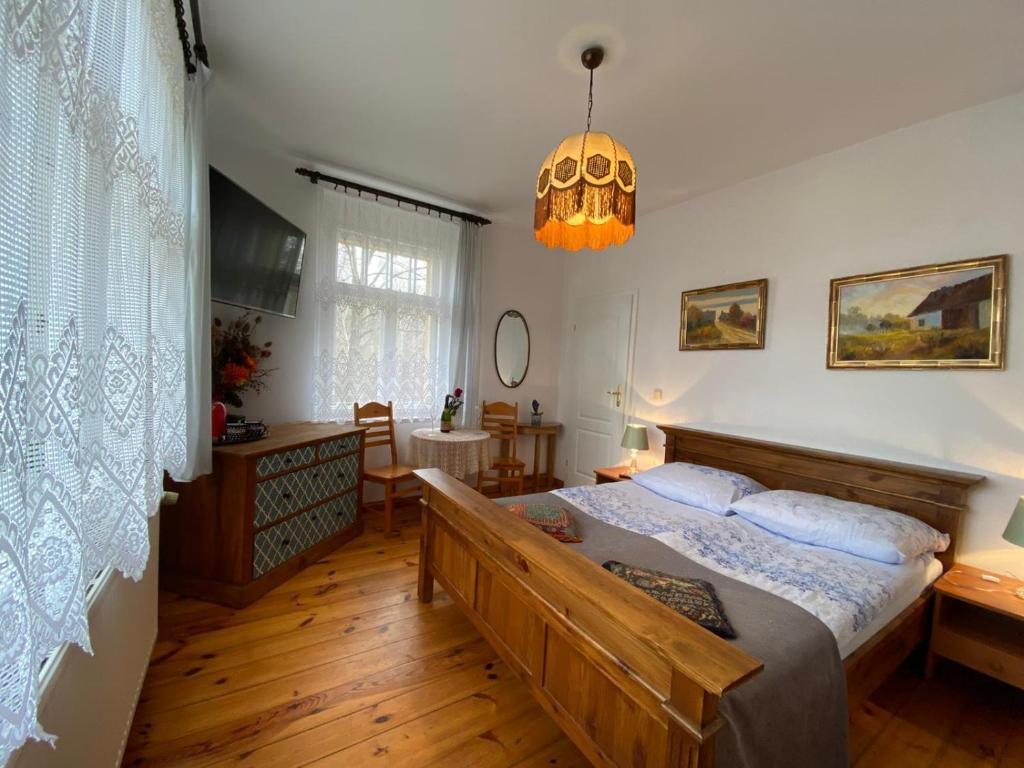 Posteľ alebo postele v izbe v ubytovaní Villa Parkowa 5