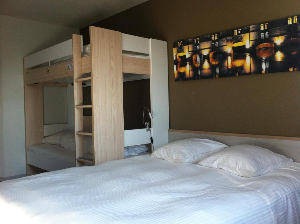 Postel nebo postele na pokoji v ubytování Als Hôtel