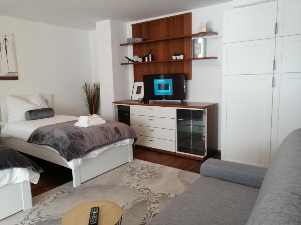 Postel nebo postele na pokoji v ubytování Alps Apartment