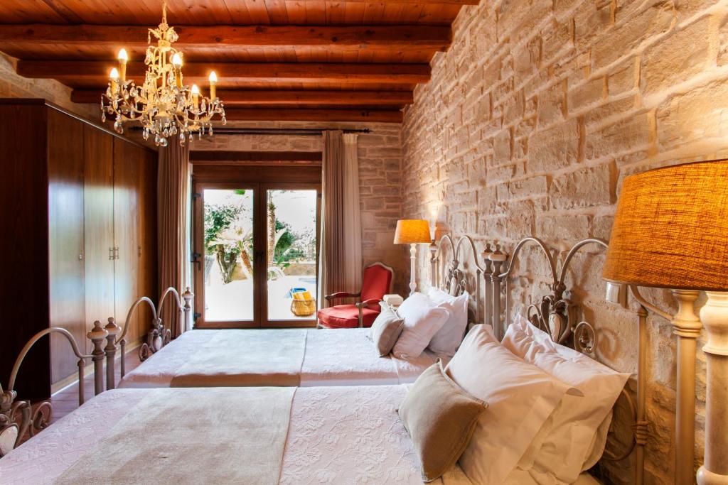 Postel nebo postele na pokoji v ubytování Eleon Residence