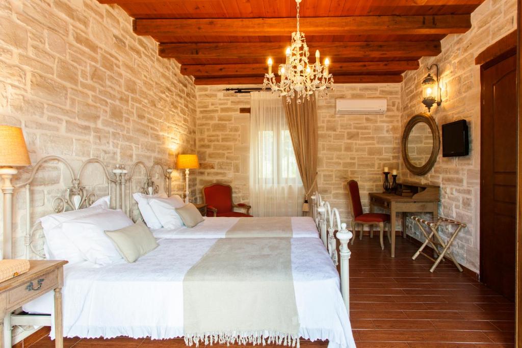 Postel nebo postele na pokoji v ubytování Eleon Residence