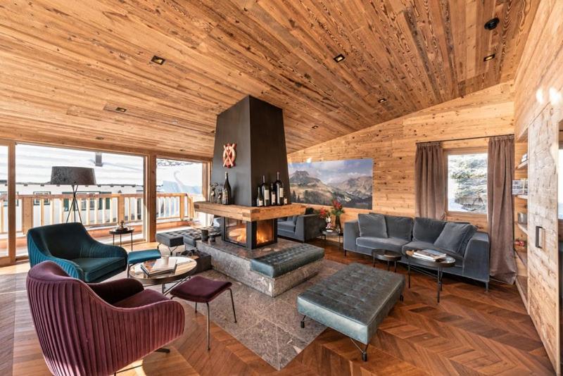 a living room filled with furniture and a fireplace at Skilodge Oberlech in Lech am Arlberg